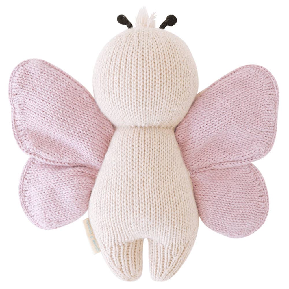 Knitted butterfly toy with pink wings on a white background