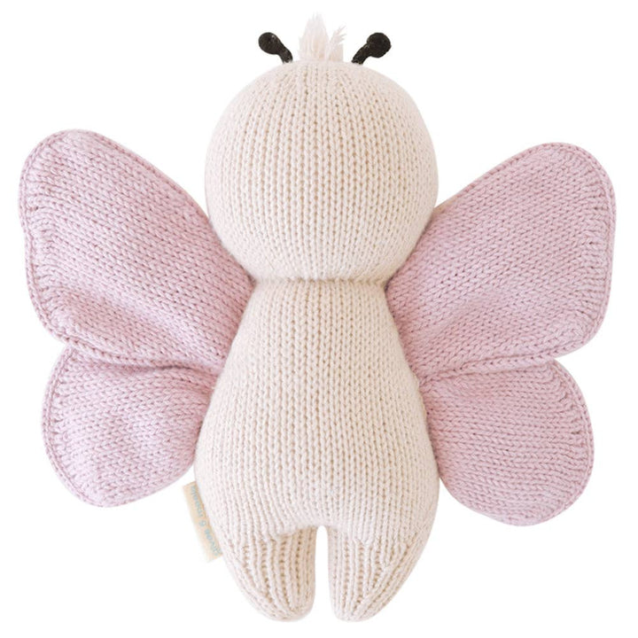 Knitted butterfly toy with pink wings on a white background