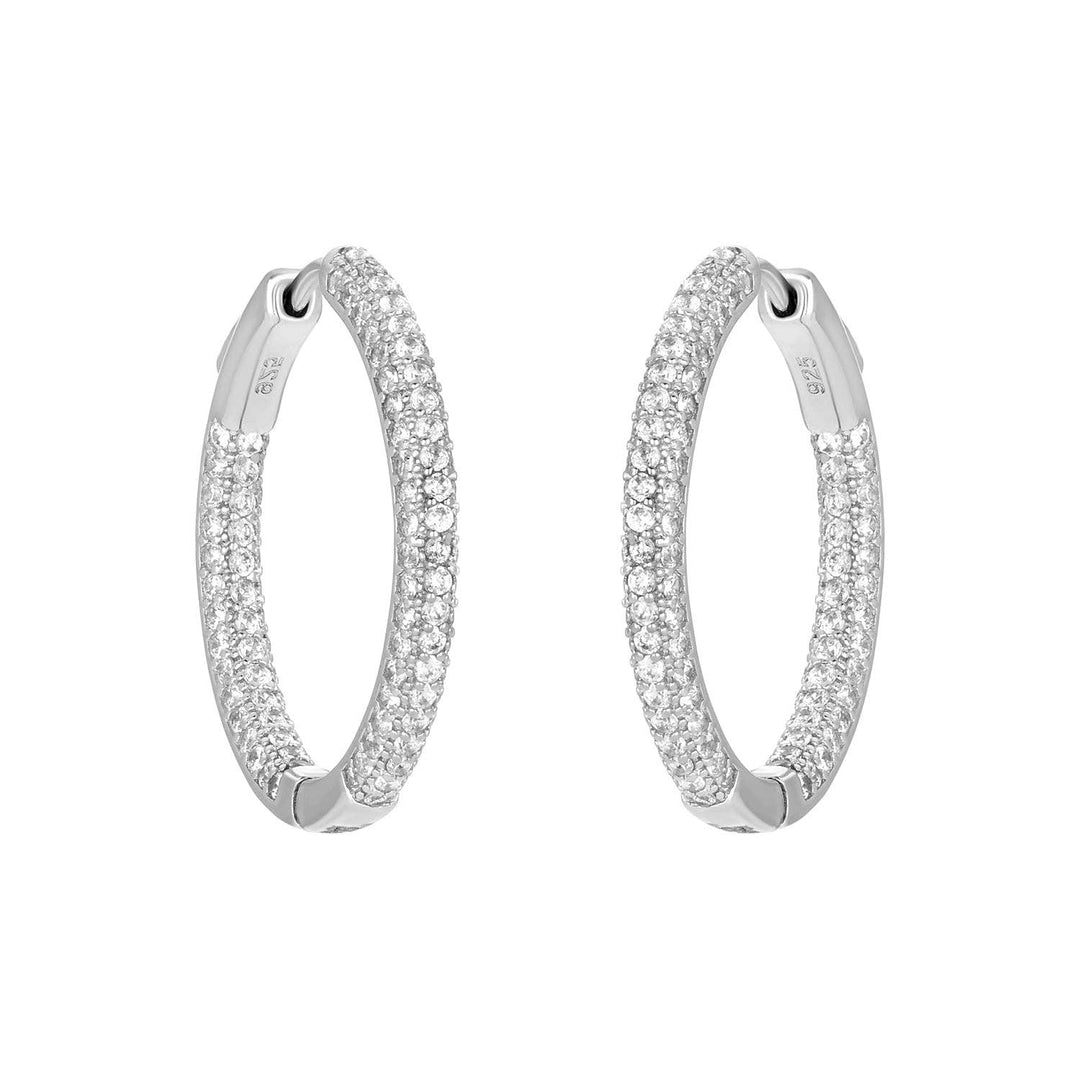 Silver triple-row cubic zirconia hoop earrings with sparkling inside-outside design.