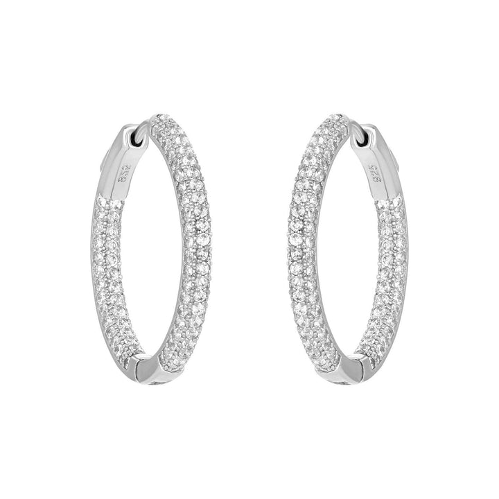 Silver triple-row cubic zirconia hoop earrings with sparkling inside-outside design.