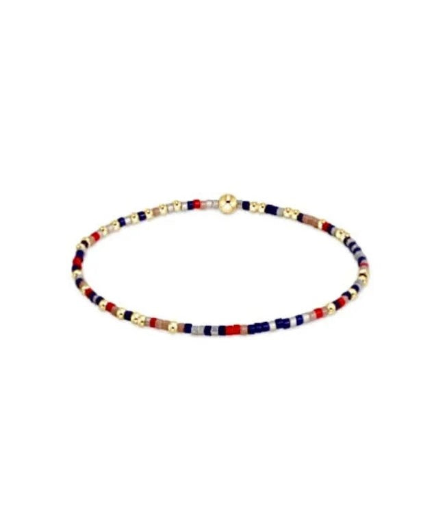Red taupe, and navy beaded bracelet with 14kt gold accents on elastic band