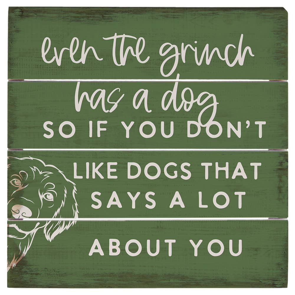 rustic green cedar wood sign reading “Even the Grinch has a dog so if you don’t like dogs that says a lot about you” with dog illustration
