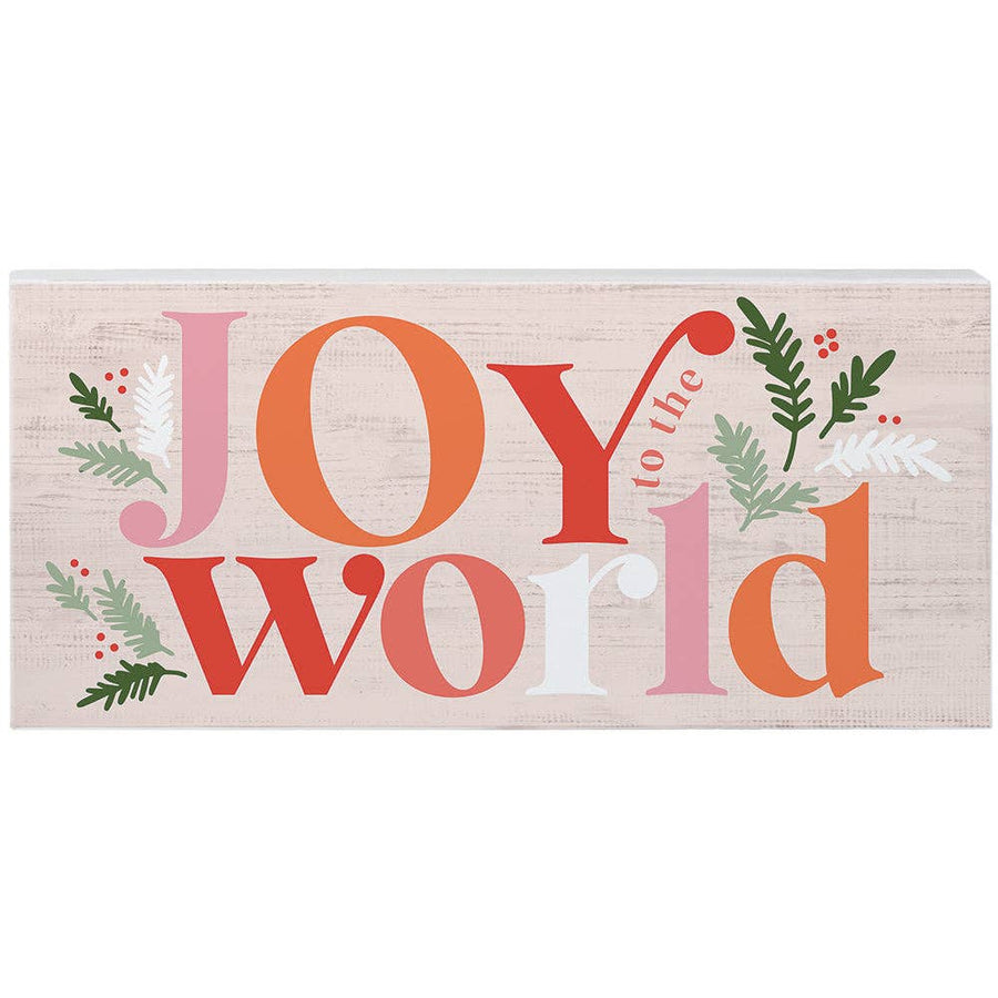 pink and coral “Joy to the World” wood sign with holiday greenery accents