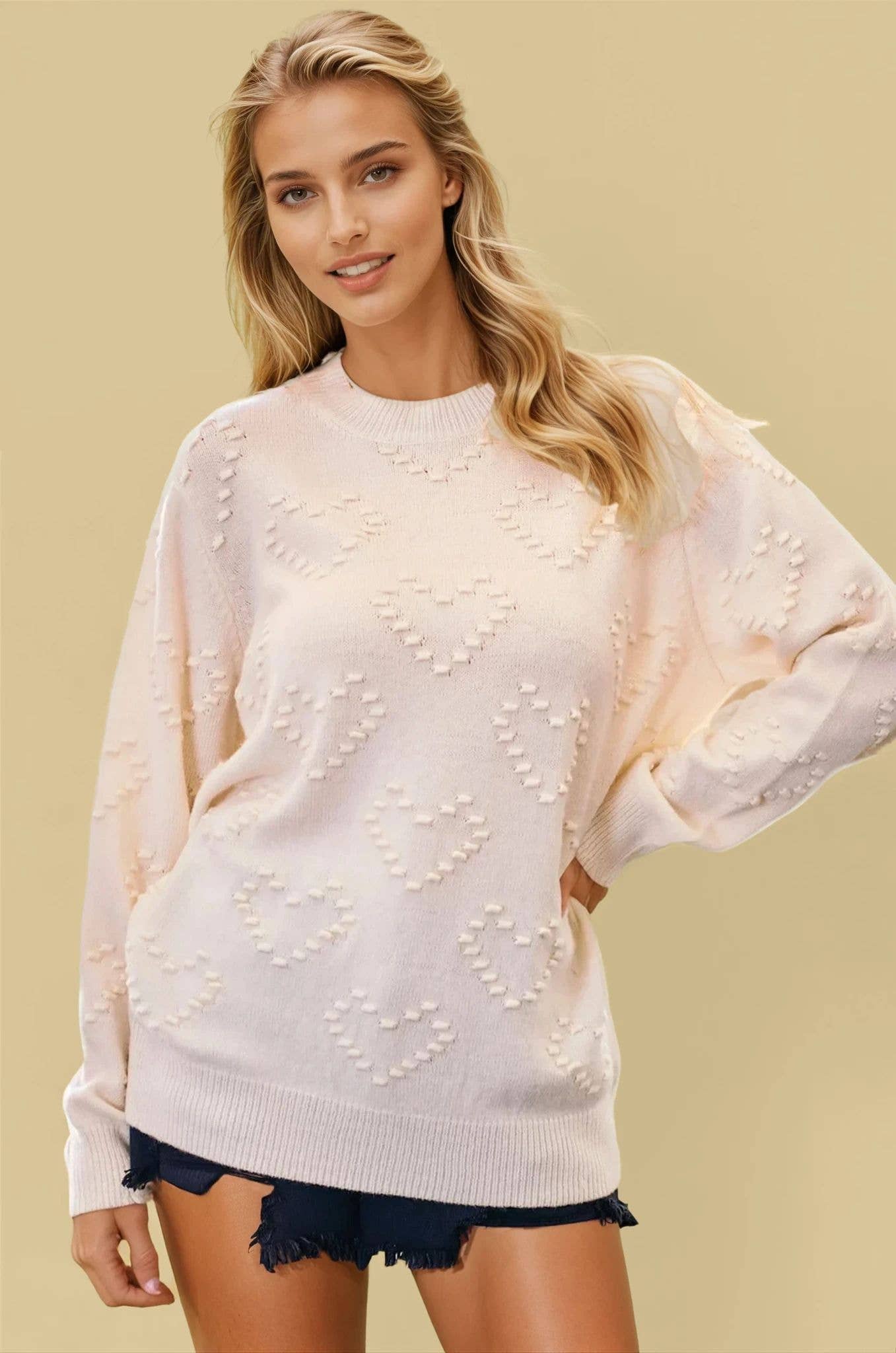 KNIT SWEATER TOP WITH HEART SHAPE DETAIL