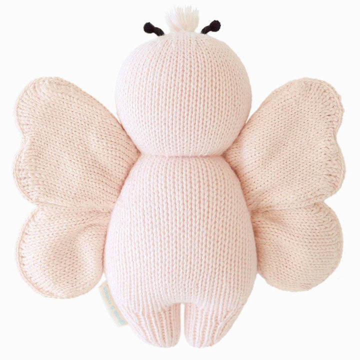 Knitted butterfly plush toy on a white background