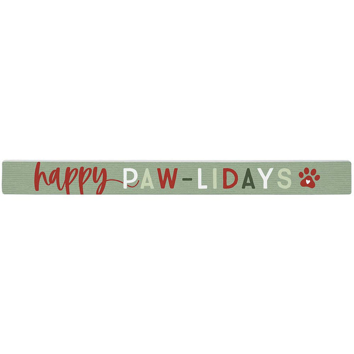 green wooden sign with the words “happy paw-lidays” and red paw print