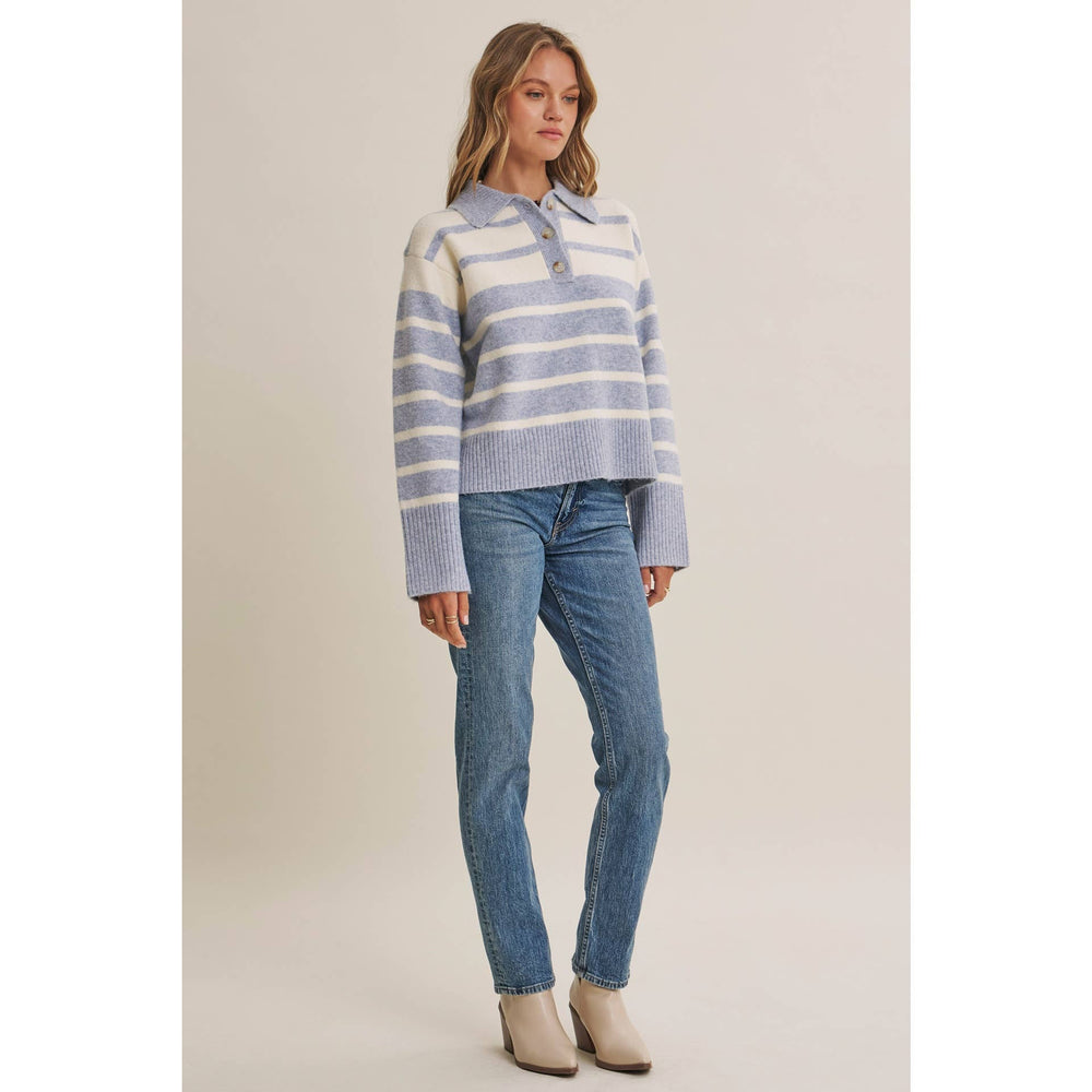 Woman wearing The Marlowe ice blue and ivory striped brushed Henley sweater with blue jeans