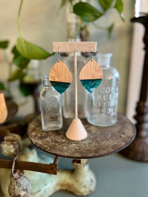 Handcrafted Aquamarine Birdseye Maple Earrings featuring natural maple wood grain, vibrant blue-green resin accents, and hypoallergenic stainless-steel hooks.