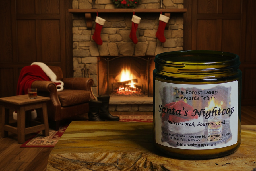 Candle labeled 'Santa's Nightcap' in front of a fireplace with Christmas stockings.