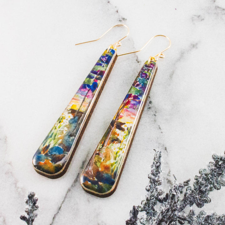Painted sunset long wood statement earrings with colorful garden landscape design and gold-filled ear wires