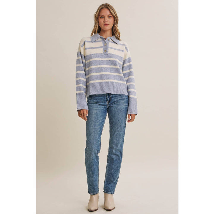 Woman wearing The Marlowe ice blue and ivory striped brushed Henley sweater with blue jeans
