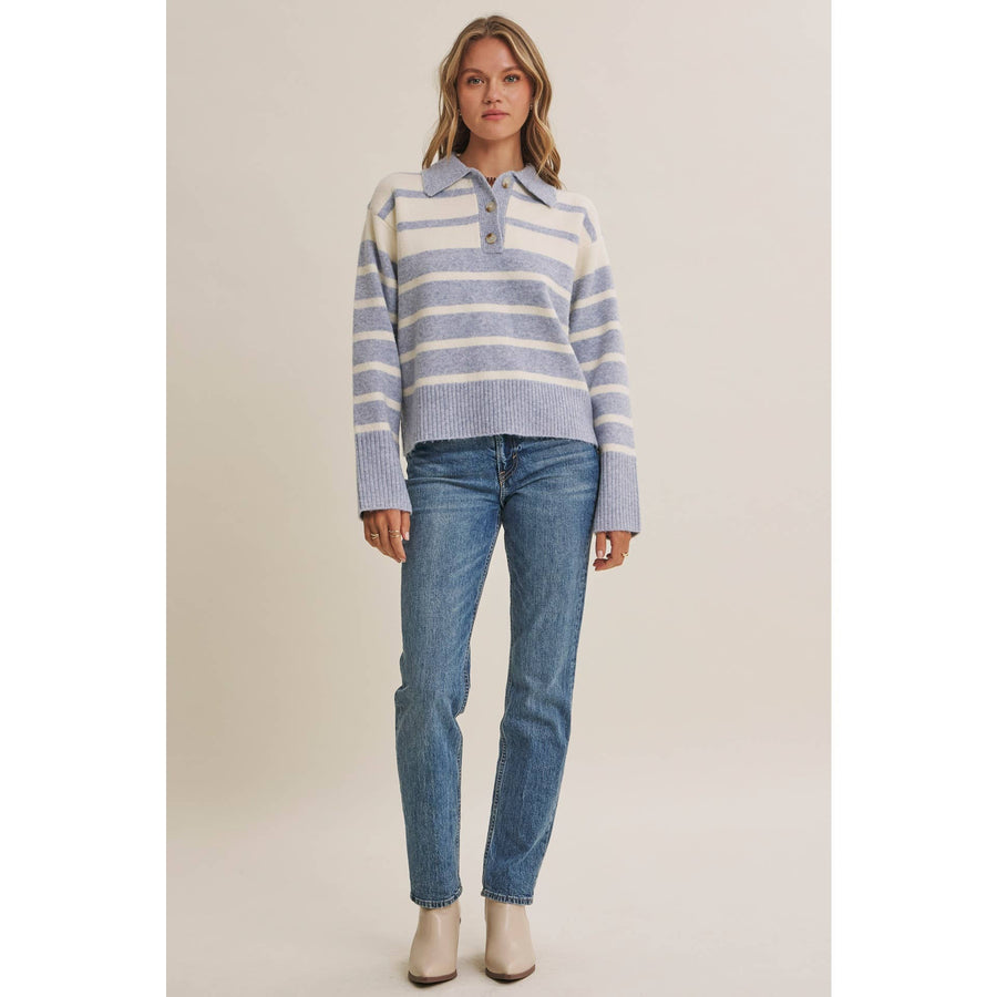 Woman wearing The Marlowe ice blue and ivory striped brushed Henley sweater with blue jeans