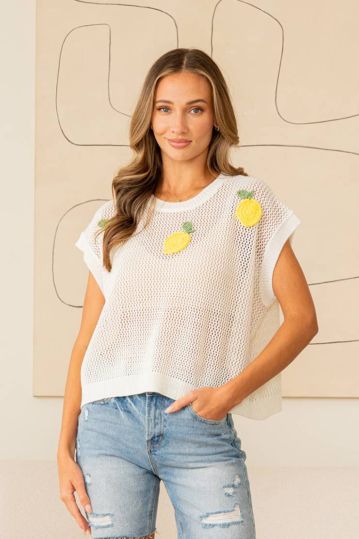 White mesh knit top with yellow lemon appliqués and relaxed boxy fit