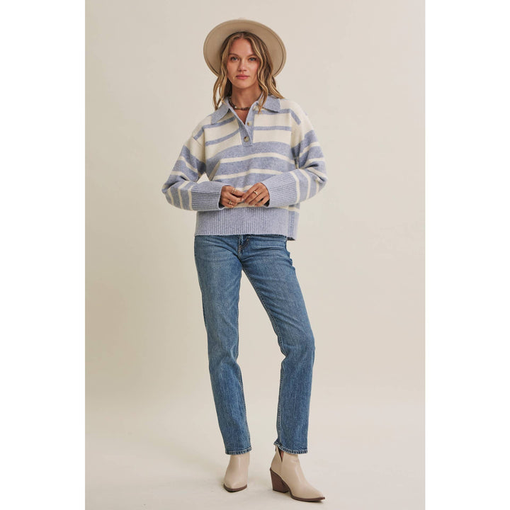 Woman wearing The Marlowe ice blue and ivory striped brushed Henley sweater with blue jeans