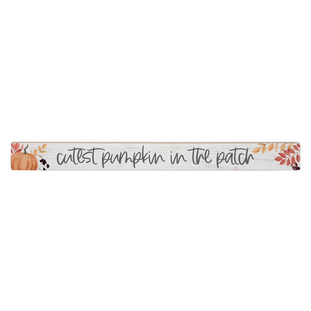 Decorative wooden sign with 'cutest pumpkin in the patch' text with pumpkin & fall leaves shown on a white background