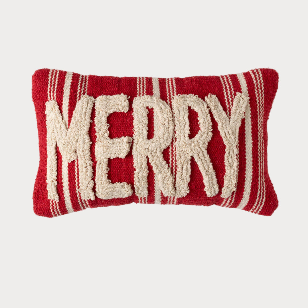 Rectangular red pillow with white tufted “MERRY” text and striped edges