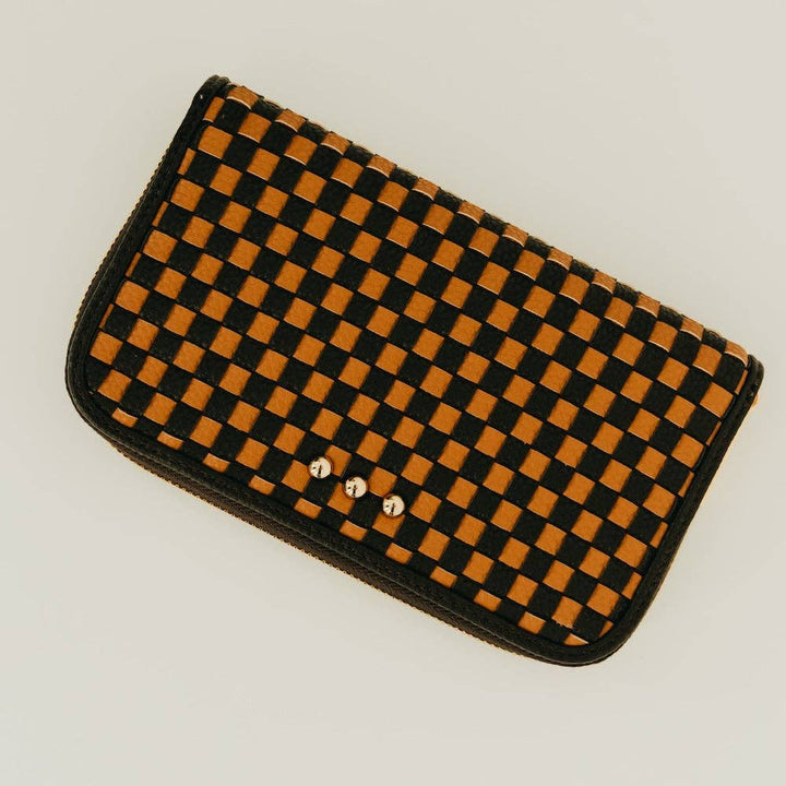 Large woven vegan leather zip wallet with tan & black checkered design, organized interior compartments, and clutch-style silhouette.