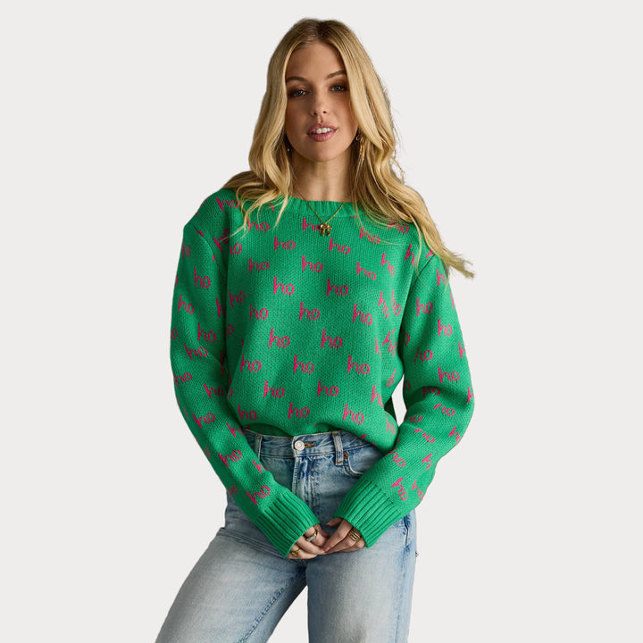 Green holiday sweater with pink “ho ho ho” text, long sleeves, and crew neckline.