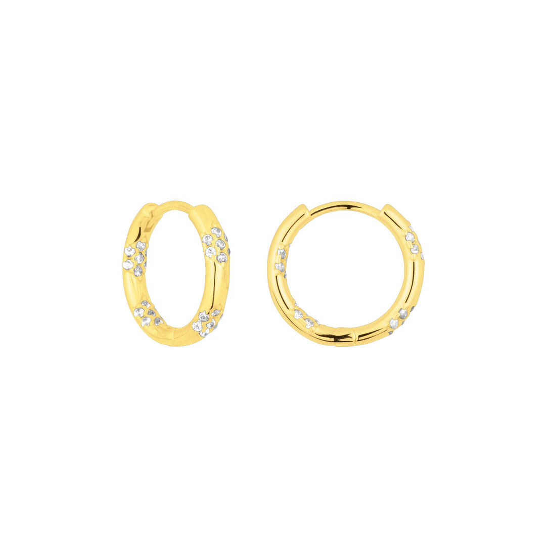 Gold huggie earrings with scattered cubic zirconia accents.