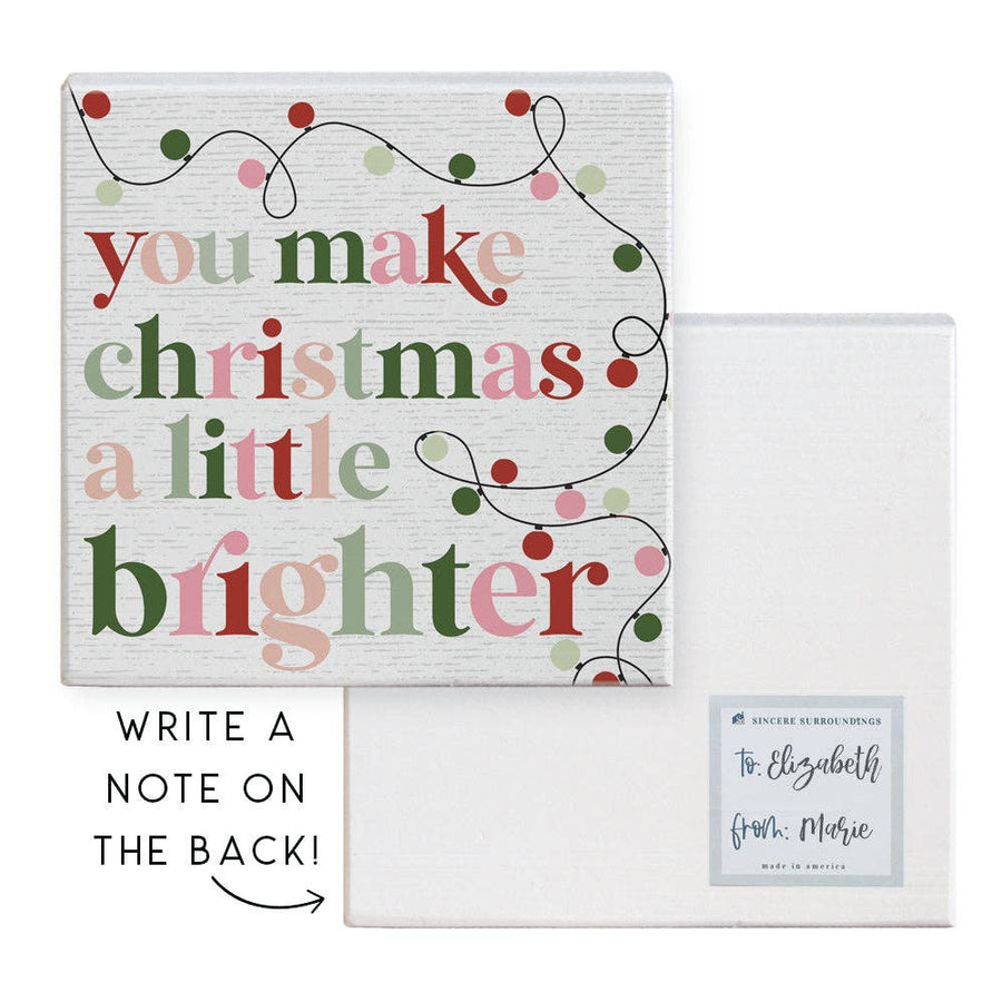 wood gift block with “You Make Christmas a Little Brighter” text and string lights design