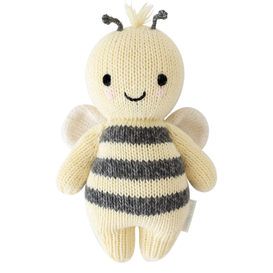 Knitted bee toy with a white background