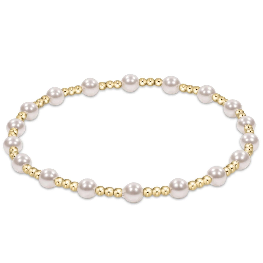 eNewton Sincerity Pearl 4mm Bracelet featuring white crystal pearls alternating with petite 14kt gold-filled beads in a stretch bracelet design